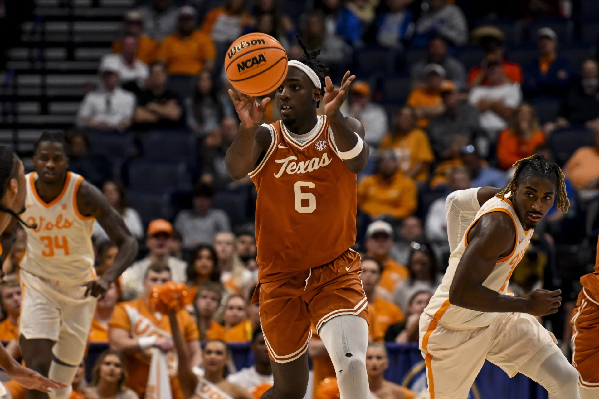 Mar 14, 2025; Nashville, TN, USA; Texas Longhorns forward Arthur Kaluma (6) passes the ball up court against the Tennessee Volunteers during the second half at Bridgestone Arena. Mandatory Credit: Steve Roberts-Imagn Images