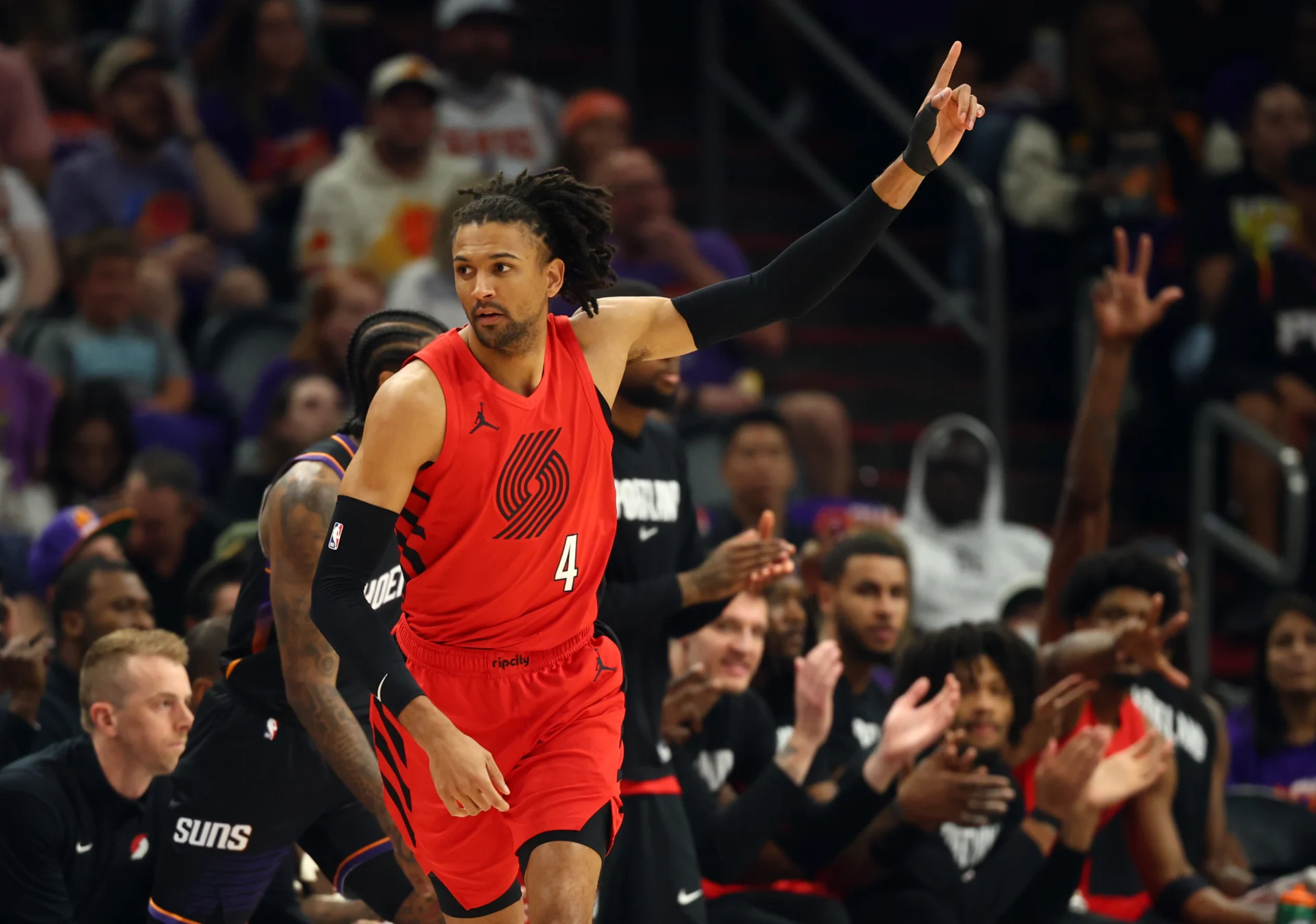 Apr 14, 2026; Phoenix, Arizona, USA; Portland Trail Blazers guard Matisse Thybulle (4) celebrates a three point shot against the Phoenix Suns in the first half during the play-in rounds of the 2026 NBA Playoffs at Mortgage Matchup Center. Mandatory Credit: Mark J. Rebilas-Imagn Images