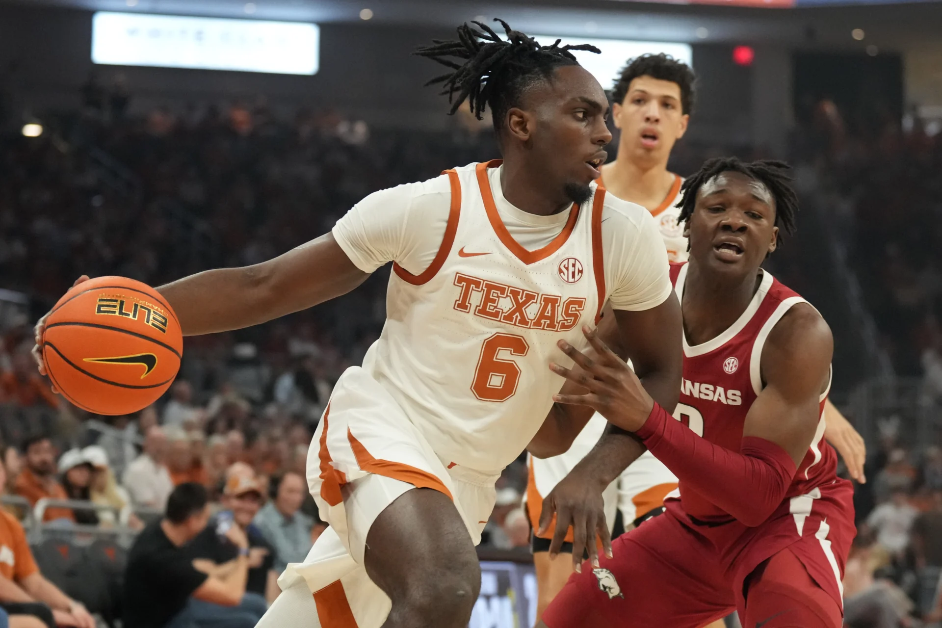 Texas Longhorns forward Arthur Kaluma (6) drives to the basket while defended by Arkansas Razorbacks forward Adou Thiero (3) during the first half at Moody Center.