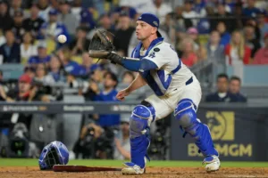 Los Angeles Dodgers catcher Ben Rortvedt (47) fields a throw to make an out at home plate against the Cincinnati Reds in the sixth inning during game two of the Wildcard round for the 2025 MLB playoffs at Dodger Stadium.