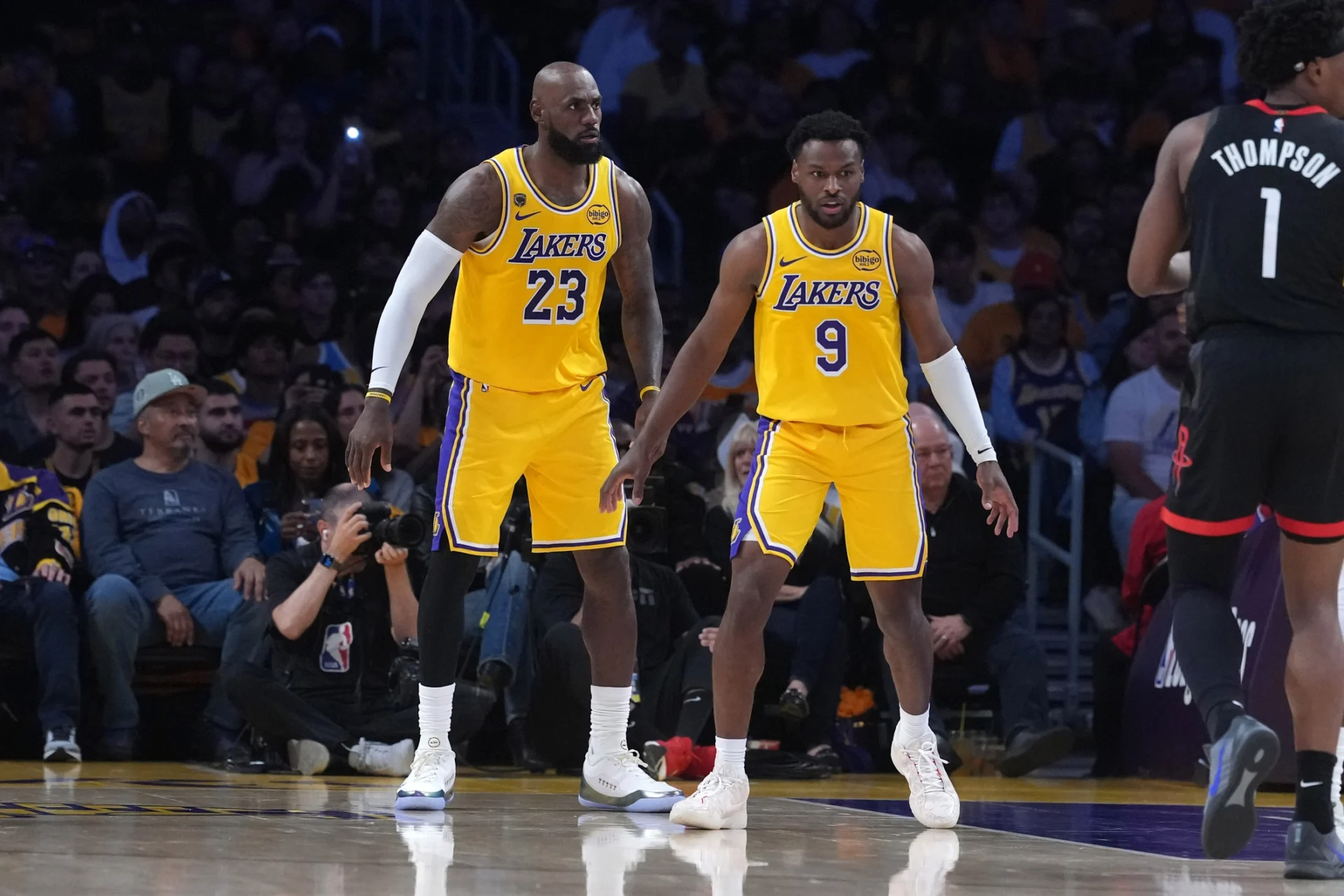 Los Angeles Lakers forward LeBron James (23) with son Bronny James (9) in the first half against the Houston Rockets during game one of the first round of the 2026 NBA Playoffs at Crypto.com Arena.